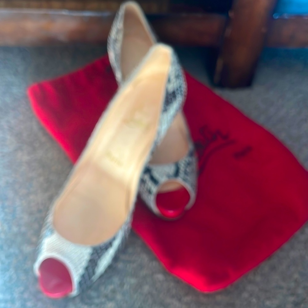 Christian Louboutin size 9 pumps. Fair condition